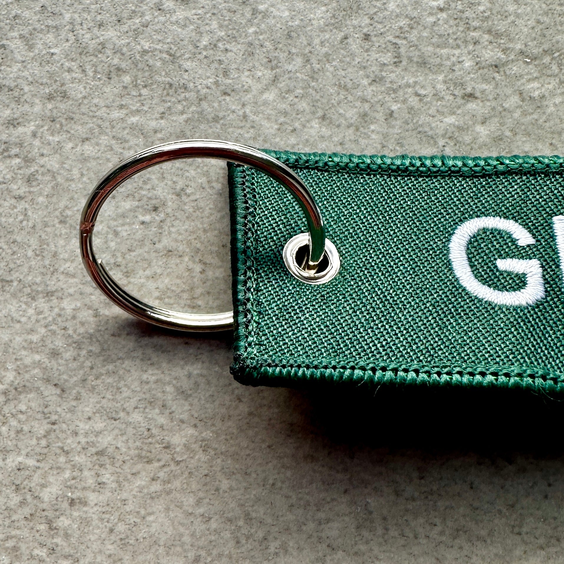 Porte‑clés Glasgow 76 — textile vert, édition rétro - Glasgow 76