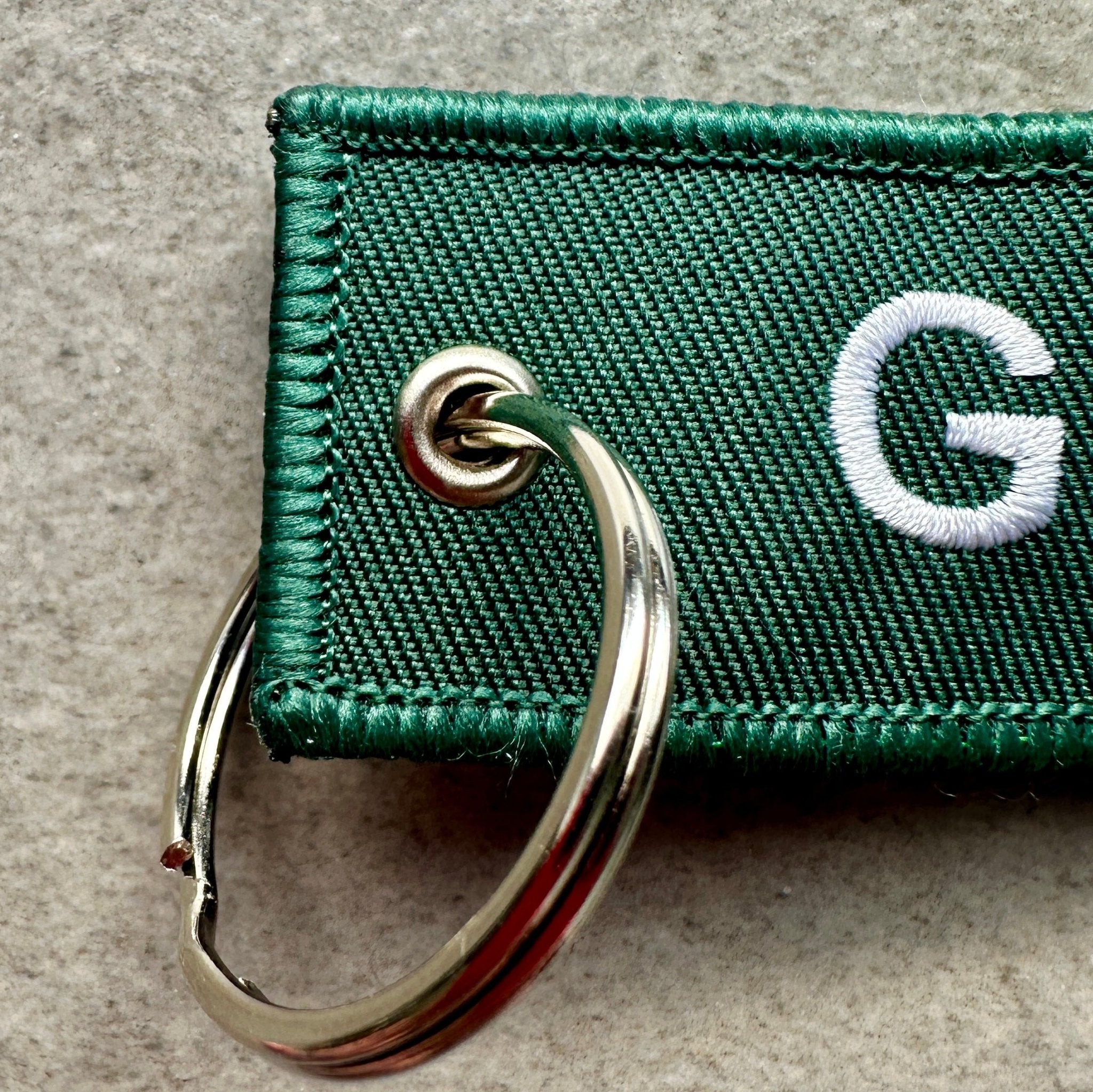 Porte‑clés Glasgow 76 — textile vert, édition rétro - Glasgow 76